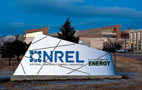 A sign in front of a building for the National Renewable Energy Laboratory, part of the Department of Energy